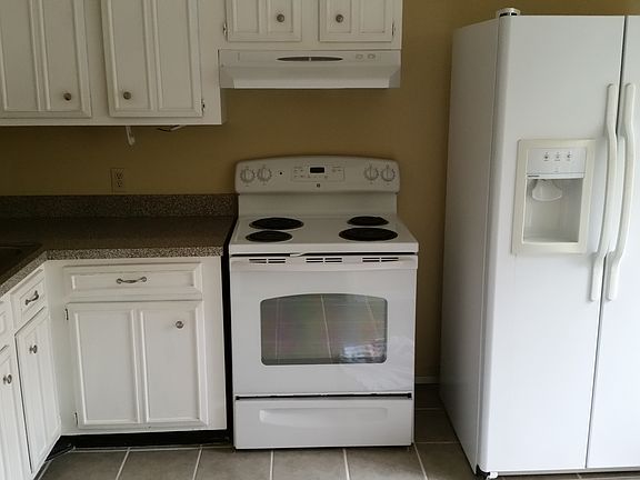 Kitchen with stove fridge & sink