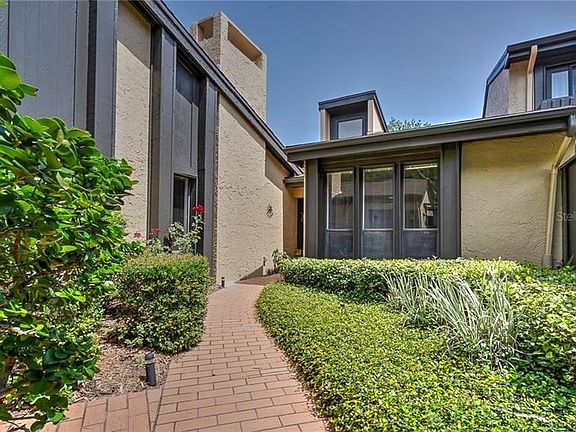 Paver brick walkway from two car garage or gate entry