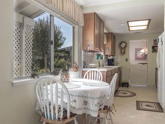 Breakfast area off kitchen with view of garden.