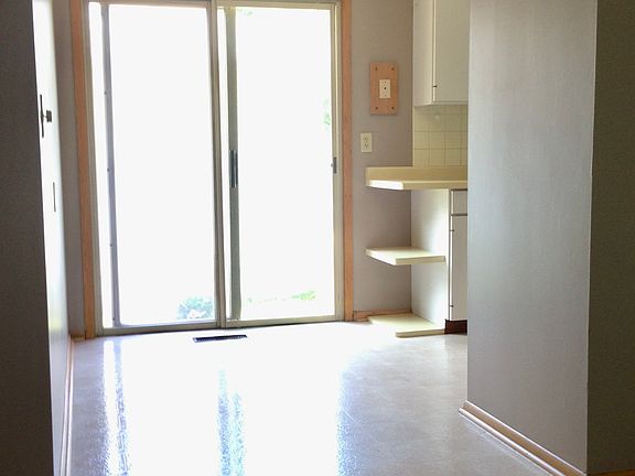 Dining area and sliding doors to outdoor patio.