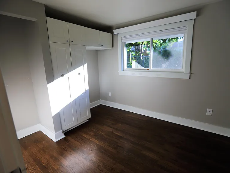 Bedroom 3. Smallest bedroom but extensive shelving and space for additional dresser or desk.