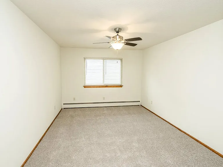 Welcome to Central Lakes of Uptown, where spacious living meets modern comfort. This inviting room offers ample natural light and a cozy atmosphere, perfect for your personal touch. Schedule a tour today and envision your new home!