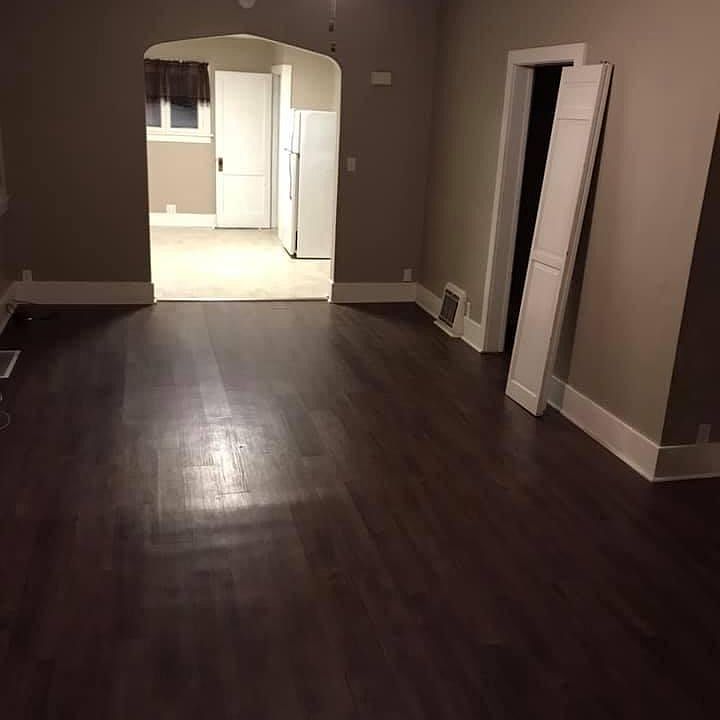 Spacious living room. View from front door to kitchen.