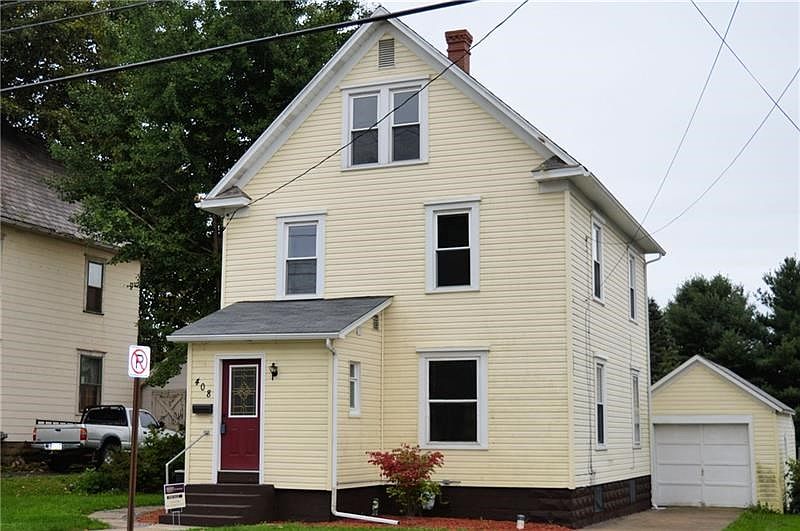 Front of home with detached garage