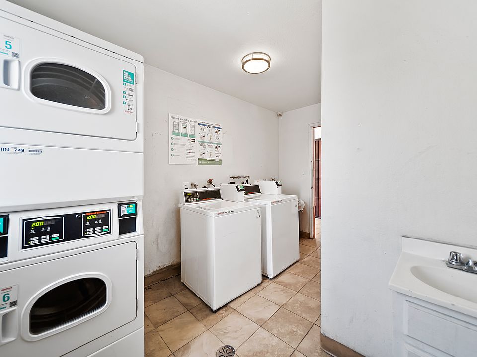 Clean and accessible laundry room with multiple machines for everyday ease.
