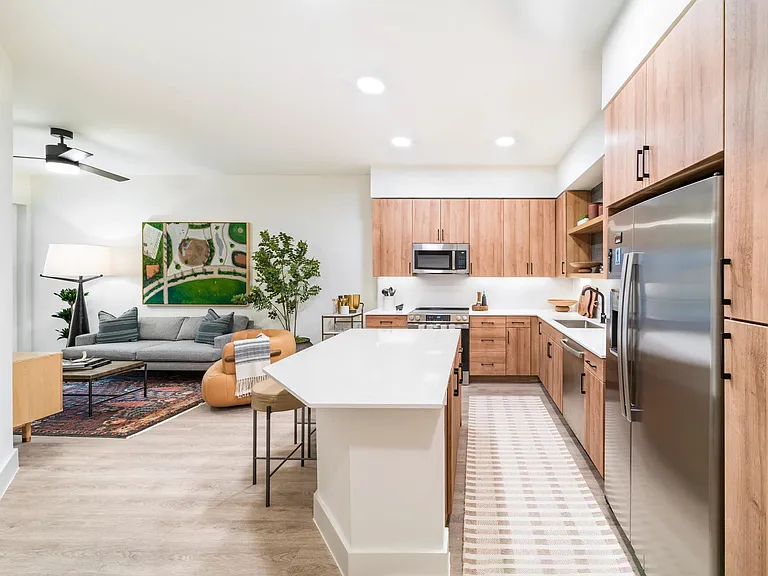 Open-concept living at Modera St. Paul combines sleek kitchens with inviting lounges, creating the perfect setting for life in downtown Dallas.