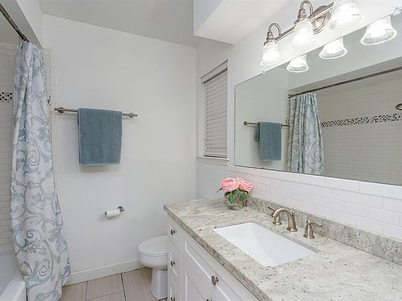Beautiful subway and mosaic tiles in the master bath tub/shower.
