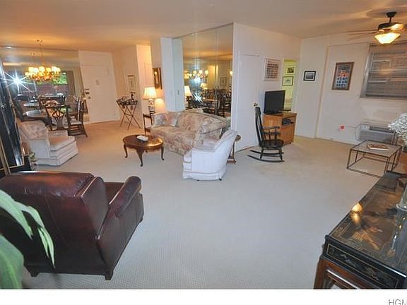 The large living room has a door leading to a private fenced in terraced/back yard. The living room 