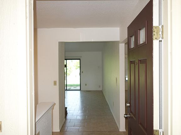 Into the front door, straight on goes into the living room, and a left brings you into the dining area and then the kitchen.