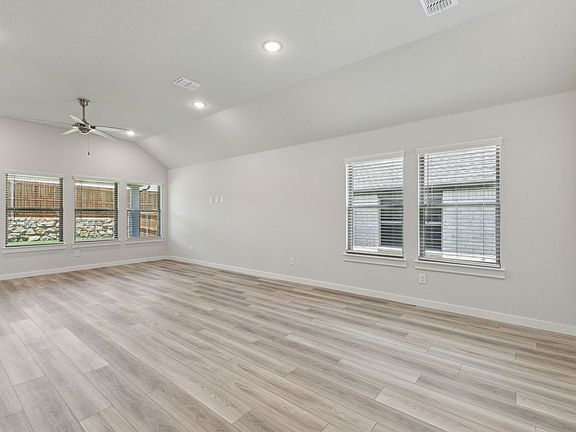 Living Room in the Quartz home plan by Trophy Signature Homes - REPRESENTATIVE PHOTO