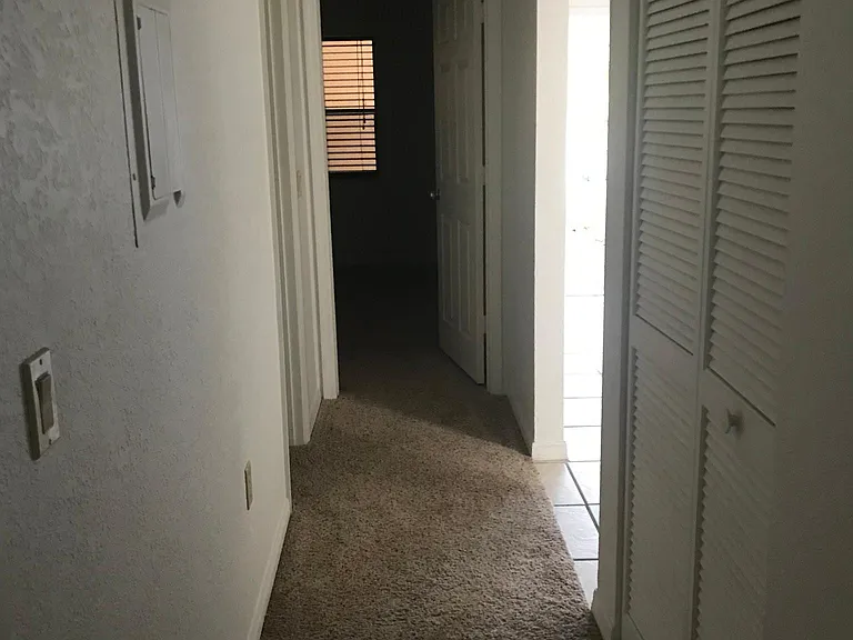 Hallway ! Living room / dining room to the right. Guest bathroom to the left. Straight ahead is guest bedroom.