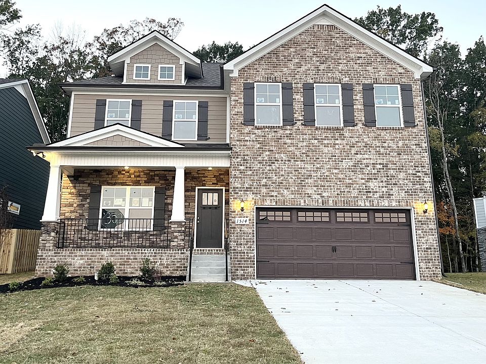 Great looking house on cul-de-sac that backs up to the woods Owner s suite down plus three bedroom