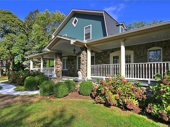 Picturesque landscaping abounds the property!