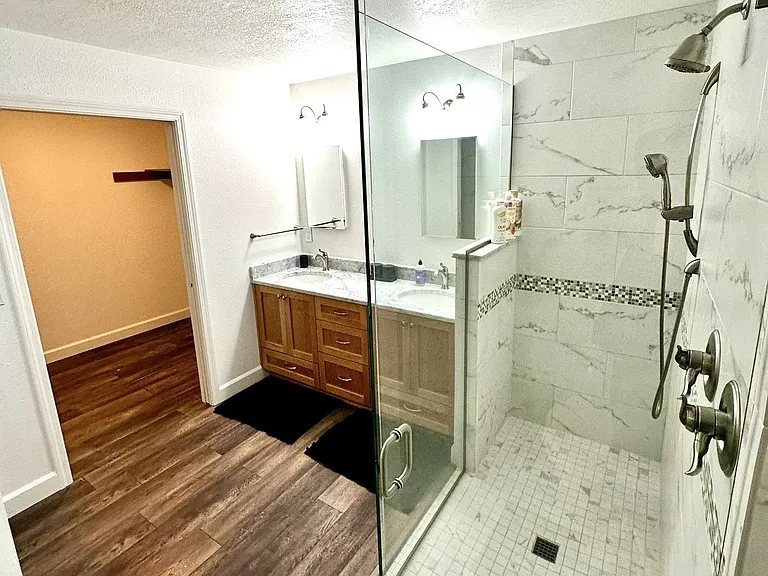 Primary bathroom, walk in shower and walk in closet.