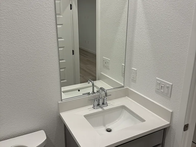 Bathroom toilet and vanity.
