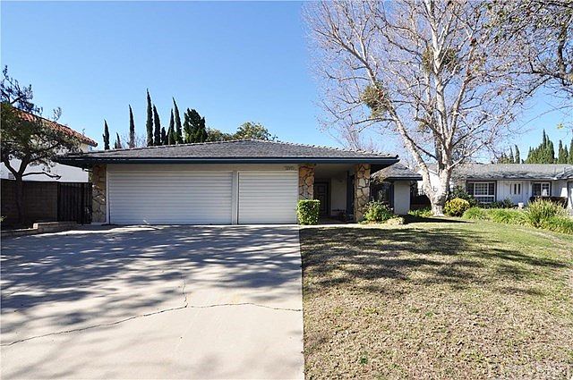 Front view showing 3 car garage