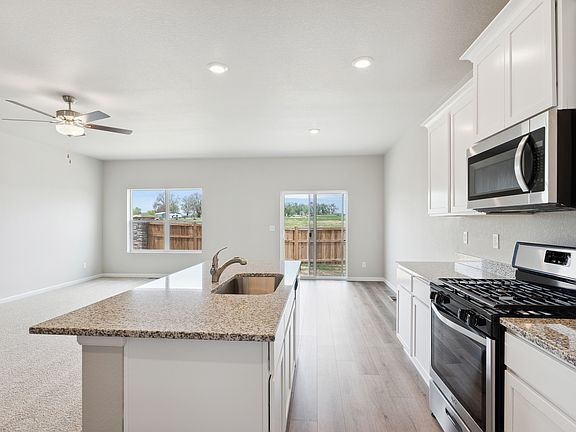 The kitchen in the Pike sits right off the dining room and family room.