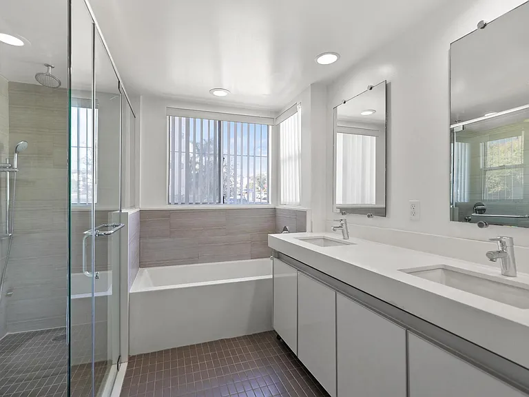 Bathroom with Double-Sink Vanity, Bathtub, and Stand-Up Shower