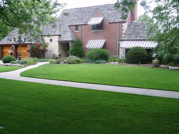 Picturesque lot with thousands of perennials - professionally landscaped.