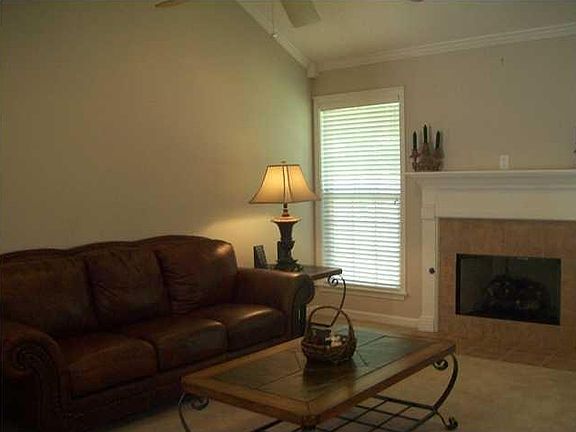 The den is spacious with a nice gas log fireplace.