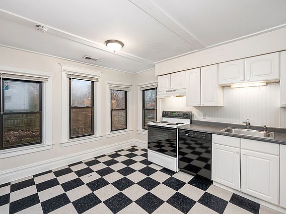 Bright and sunny eat-in kitchen with dishwasher.