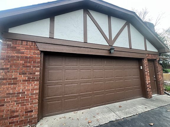 2 1/2 car garage with remote panel & side entrance door, newly paved blacktop driveway