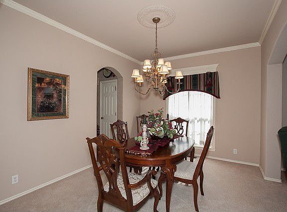 Formal living room with vaulted ceiling