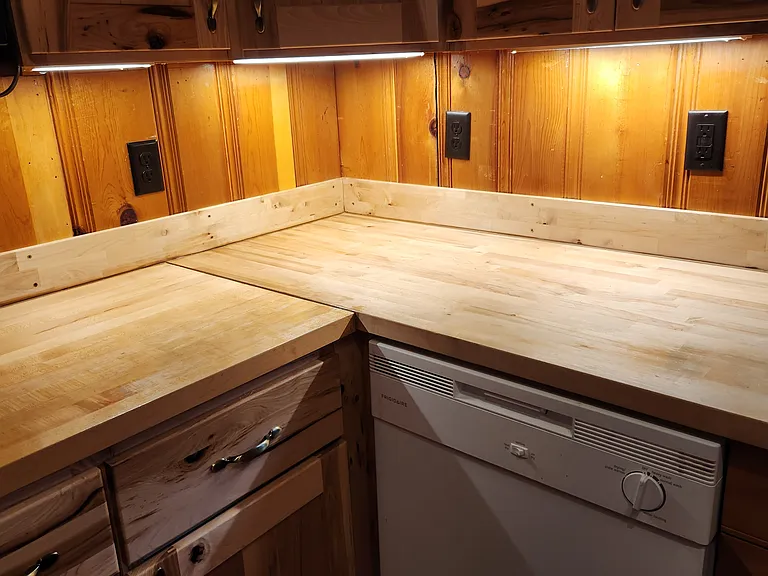 There is extra lighting under the cabinets.
