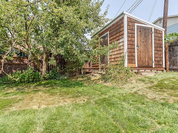 Back yard area that includes secure storage building.