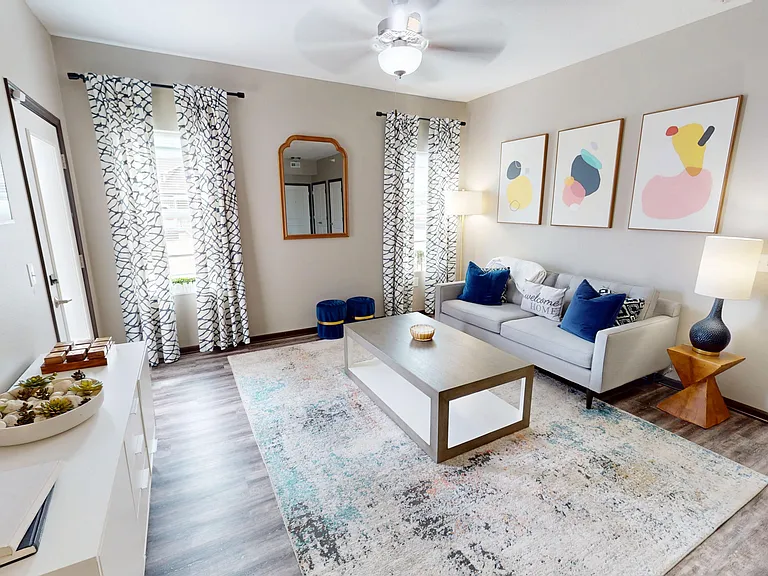 The Hub includes a a spacious living room with natural light and private patio/balcony access.