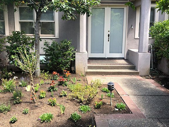 Beautiful gated private entrance and newly landscaped garden.