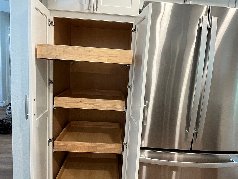 Custom built-in pantry with pull out, soft close drawers.