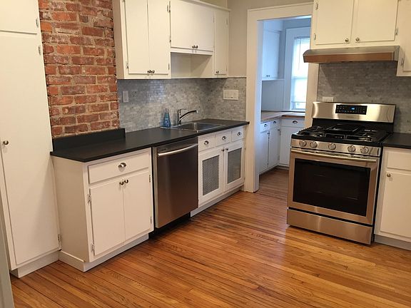 Newly renovated kitchen with new gas range, new dishwasher a