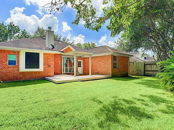 **BEFORE PHOTO** Spacious back yard with pergola & back patio.