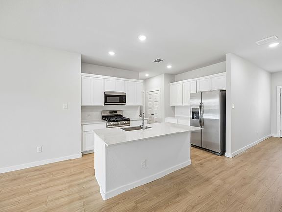 Kitchen in the Mesquite home plan by Trophy Signature Homes - REPRESENTATIVE PHOTO