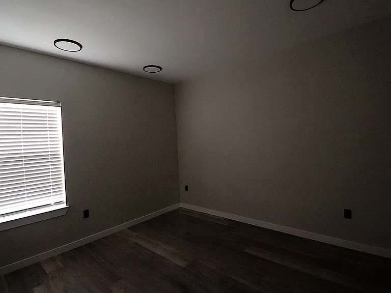 Bedroom 4 of 4 featuring modern flooring, recessed lighting, natural light, and a spacious closet.