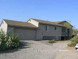 View of house with garage