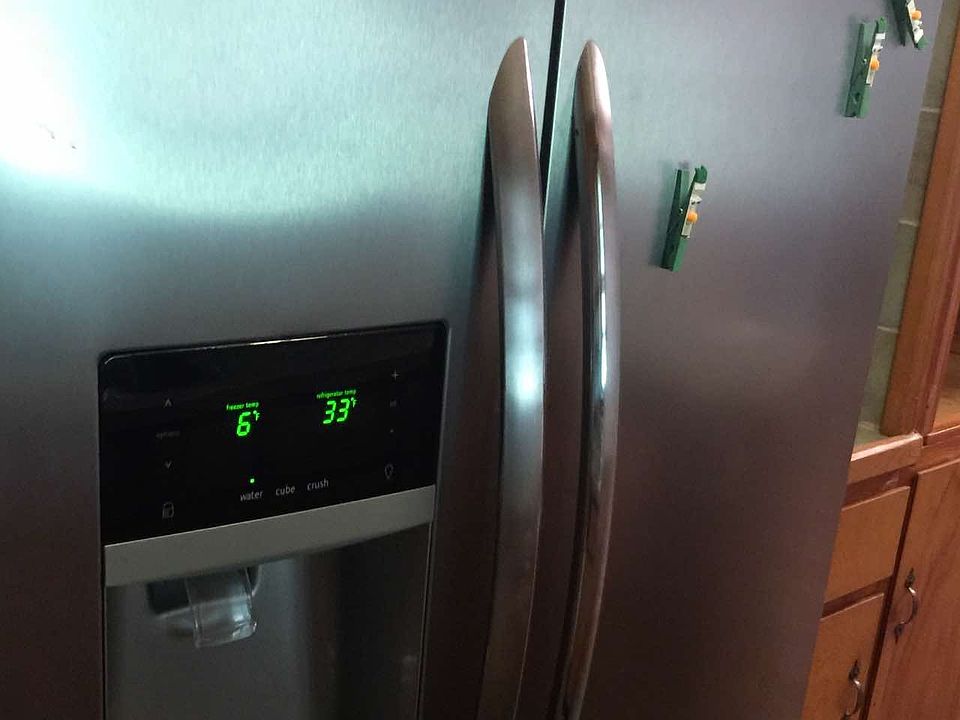 Nice refrigerator--kitchen has efficient "work triangle."