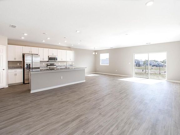 The downstairs is finished with luxe, low-maintenance wood vinyl plank flooring - New home for sale