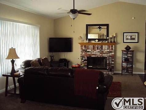 Family room with brick fireplace.