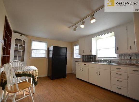 Kitchen - features refrigerator and built-in hutch.