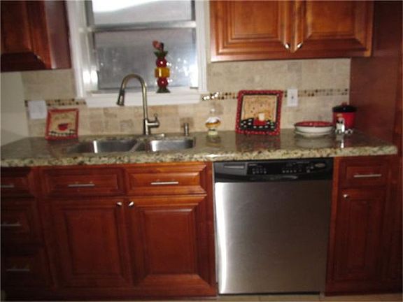 VIEW OF KITCHEN AND BREAKFAST, NEW GRANITE COUNTERS, AND CUSTOM CABINETS