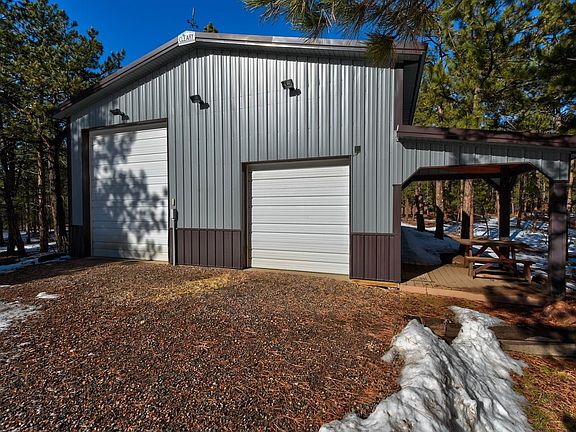 Detached garage is 1744 sq ft with side door entrance and doors large enough to store an RV.