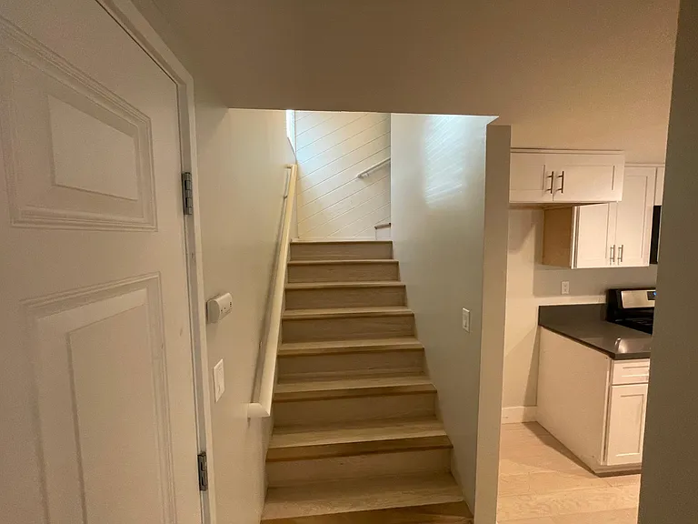 Stairwell next to Front Door Entrance