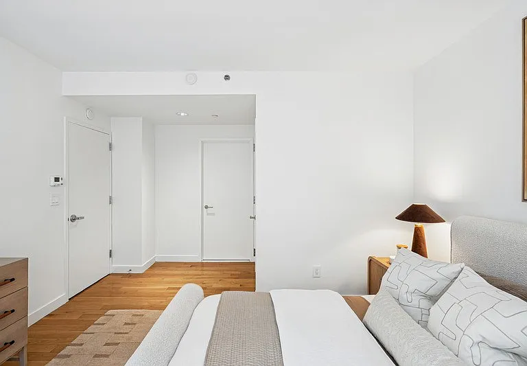 Elevate your living with Arbor's spacious and modern bedroom, showcasing natural light and sleek design. Embrace comfort with ample storage and sophisticated finishes. Explore your new home today!