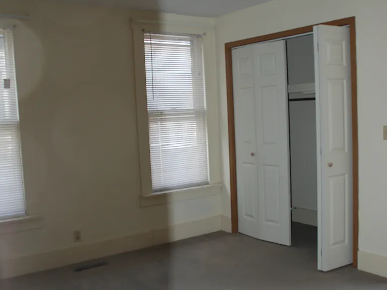 Bedroom number 2. Two of the 3 windows plus the large closest.