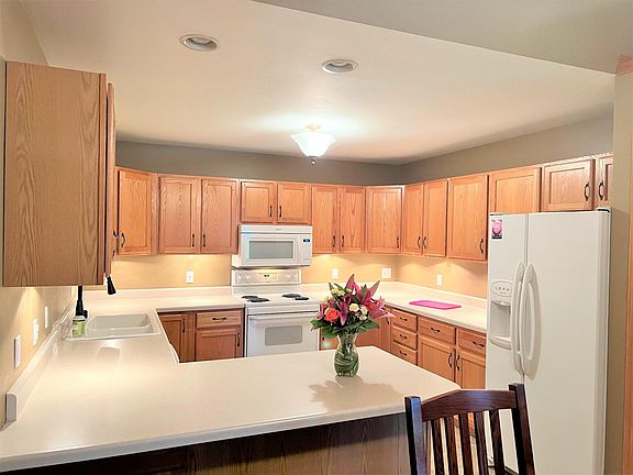 Pantry to the right of the fridge