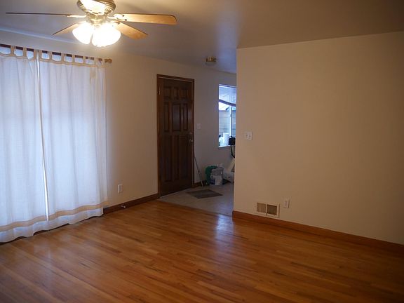 a view of the entryway from next to the fireplace