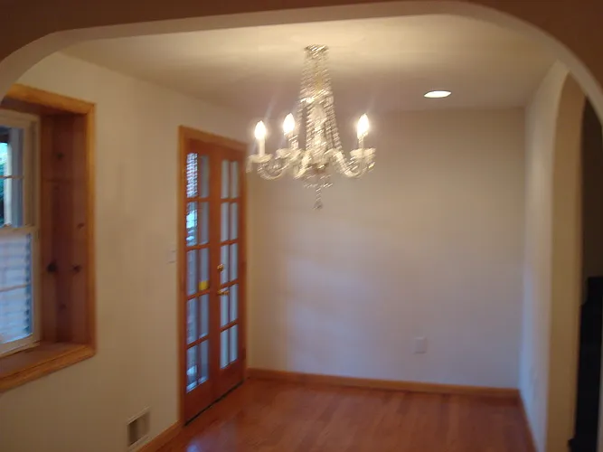 The dining room on was converted to 3rd bedroom on main level. Now has ceiling fan. Door leads to patio.
