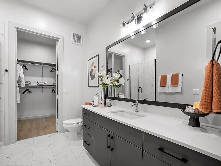 Experience luxury in this modern bathroom, featuring sleek design and ample storage space. Experience luxury in this modern bathroom, featuring sleek design and ample storage space.